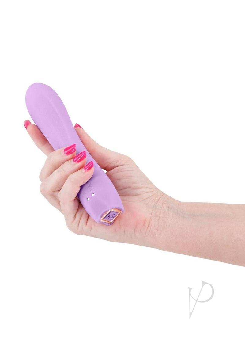 Obsessions Romeo Rechargeable Silicone Vibrator Lavender held in hand, showcasing its sleek design and soft silicone texture.