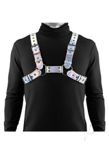 Cosmo Harness Rogue Chest Harness Small/Medium Rainbow worn over a black turtleneck, showcasing its striking design.