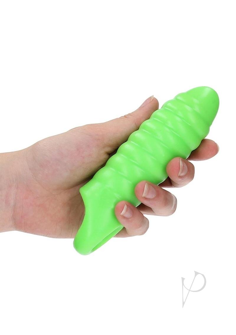 Ouch Swirl Thick Penis Sleeve Glow in the Dark Green held in hand, showcasing its glowing design and thick texture.
