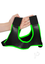 Ouch Neoprene Harness Glow in the Dark Large XLarge Green held in hand showing fluorescent green detailing.