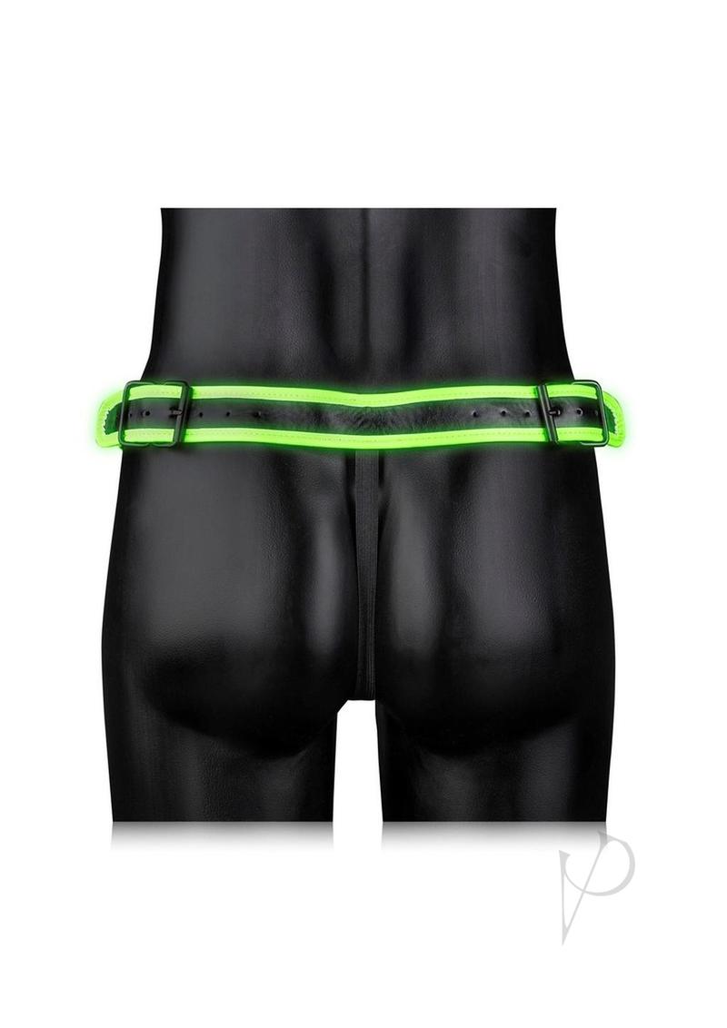 Ouch Buckle Jock Strap Metal Glow in the Dark Green on a mannequin, showcasing its luminous design and bondage aesthetic.