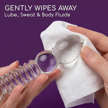 Astroglide Get Flirty Sex Toy Cleaner Wipes 20 Pack gently cleaning a pleasure toy using a wipe.