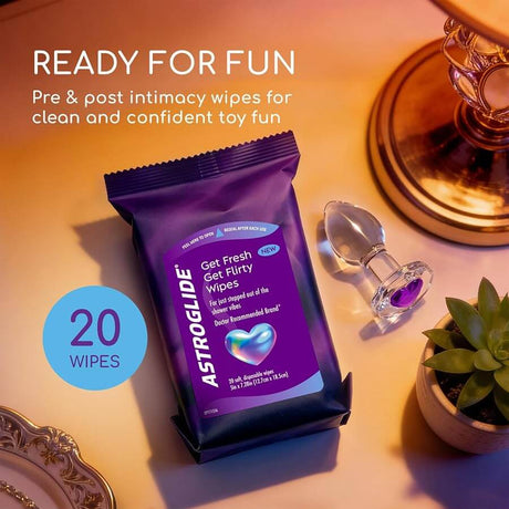Astroglide Get Flirty Sex Toy Cleaner Wipes 20 Pack with a sleek design and a toy beside them.