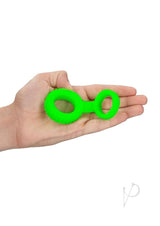 Ouch Cock Ring and Ball Strap Glow in the Dark Green held in hand showcasing its vibrant glow-in-the-dark design.