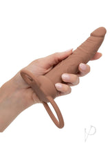 Performance Maxx Silicone Dual Penetrator Chocolate held in hand, showcasing the supportive ring design.