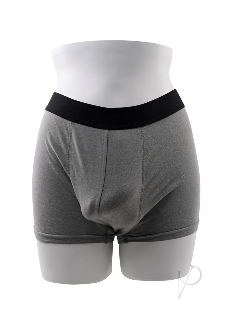 Gender X TPE Packer Dildo 4 inch Caramel displayed in gray packing shorts on a mannequin.