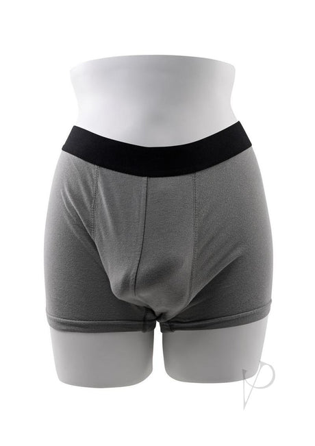 Gender X TPE Packer Dildo 4 inch Caramel displayed in gray packing shorts on a mannequin.