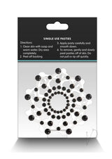 Pretty Pasties Charm III Nipple Covers Black packaging with application instructions and design details.
