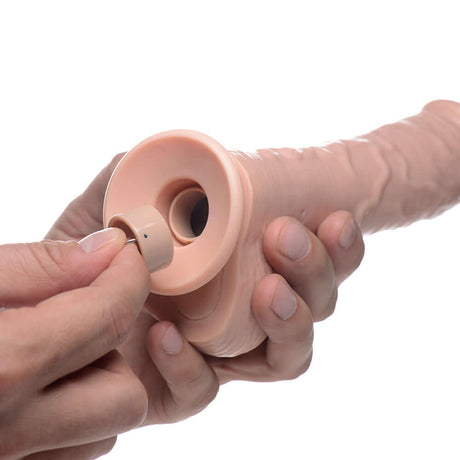 Person adjusting the control on the Loadz 7 inches Vibrating Squirting Dildo Light, showcasing its user-friendly design.