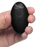 Loadz 7 inches Vibrating Squirting Dildo Light remote control in hand with buttons for versatile play.