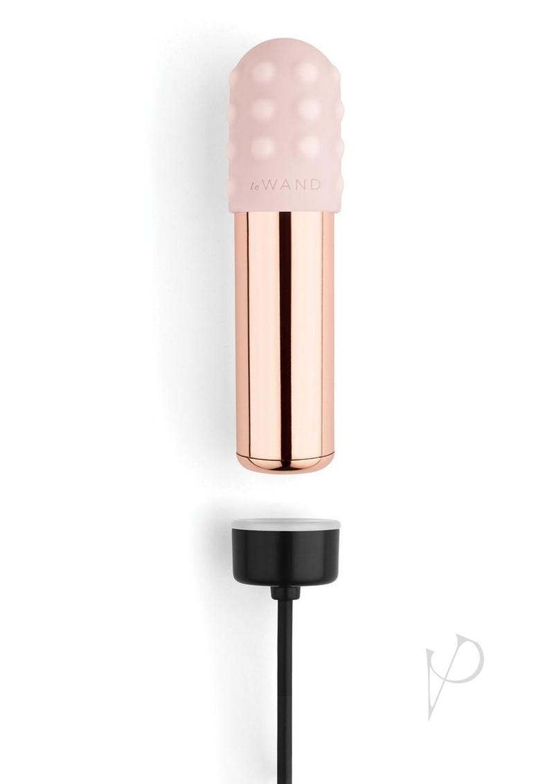 Le Wand Bullet Silicone Sleeve Vibrator Rose Gold with a silicone tip and charger base in a stylish design.