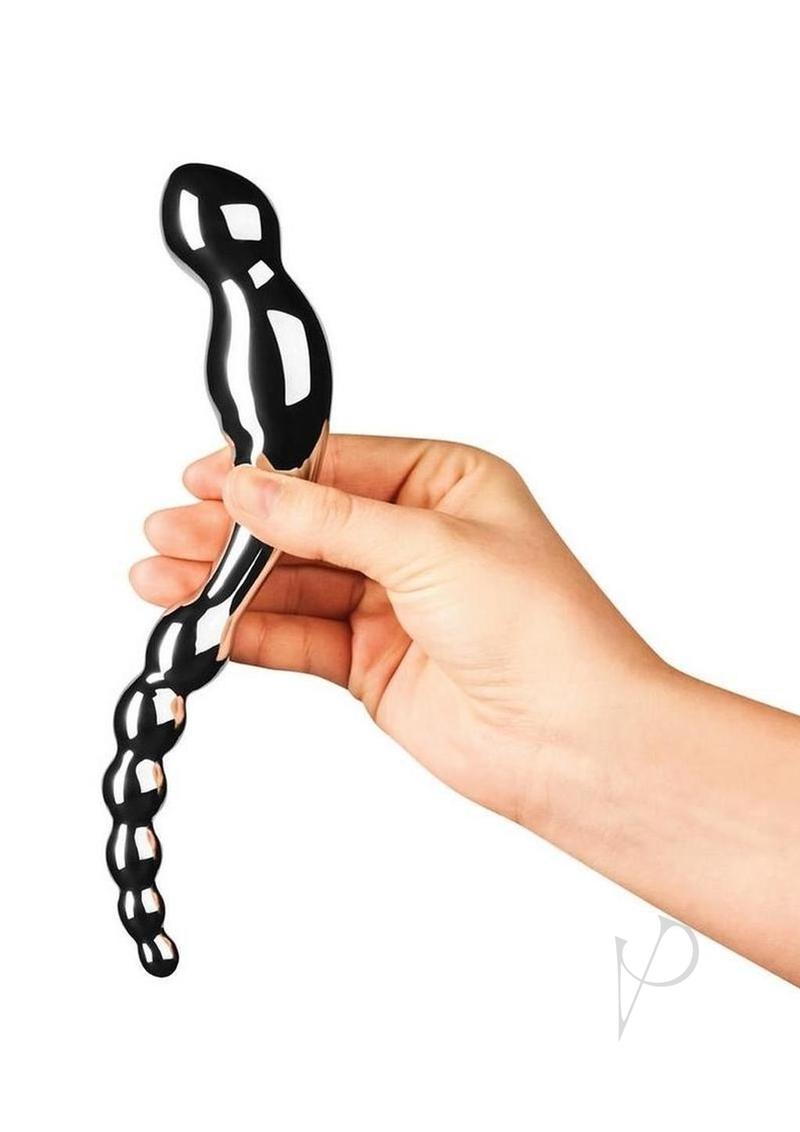 Person holding the Le Wand Swerve Dual End Probe Stainless Steel for targeted pleasure and stimulation.