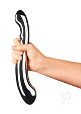 Hand holding the Le Wand Contour Dual End Dildo Stainless Steel, showcasing its sleek and sculpted design.