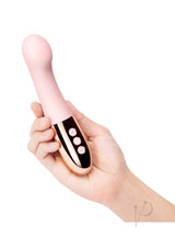 Le Wand Gee Silicone G-Spot Vibrator Rose Gold held in hand, showcasing its flexible design and control buttons.