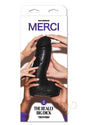 Merci The Really Big Dick 12 Inch Suction Cup Dildo Black packaging with hands holding it.