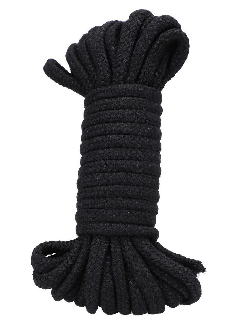 In A Bag Cotton Bondage Rope 32 Feet Black rolled neatly, perfect for restraint play and made from soft cotton.
