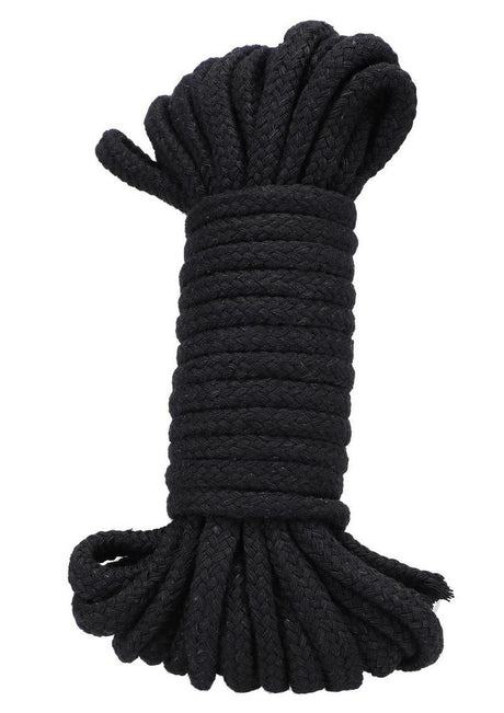 In A Bag Cotton Bondage Rope 32 Feet Black rolled neatly, perfect for restraint play and made from soft cotton.