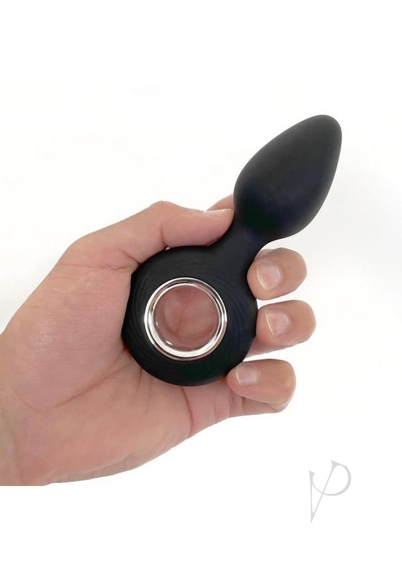 Vers Plug Vibrating Rechargeable Silicone Anal Plug Black held in hand, showcasing its sleek design and features.