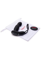 Envy Thruster P-Spot Vibrator & Ring with Remote Control lying next to its remote and storage pouch.