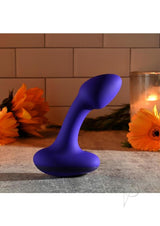 Gender X Anybody's Plug Silicone Vibrating Butt Plug Blue displayed with flowers and candle background.
