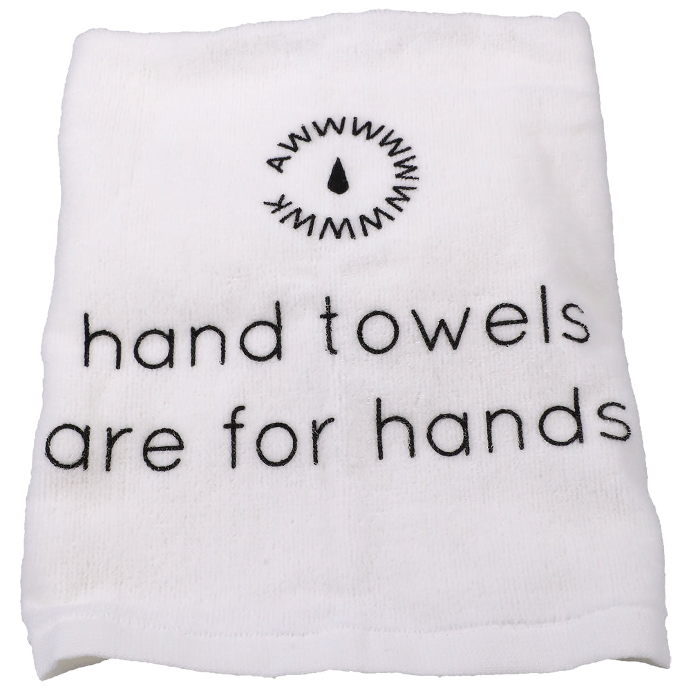 White hand towel with the text 'hand towels are for hands' printed on it.