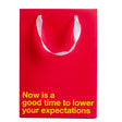 Lower Your Expectations Color Gift Bag Red featuring bold message on red background.