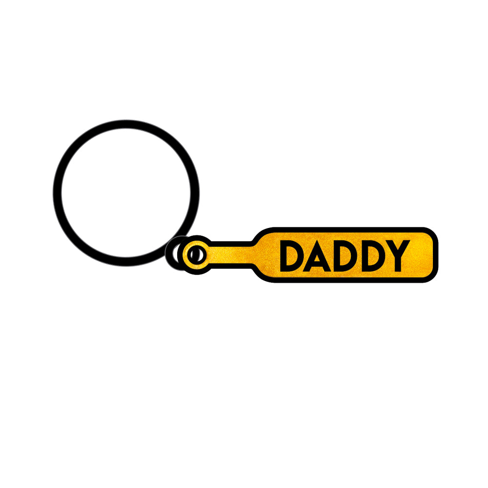 Wood Rocket Daddy Paddle Keychain featuring a playful yellow paddle design with the word 'DADDY'.