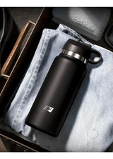 PDX Plus Fap Flask Thrill Seeker Stroker Frosted/Black water bottle design on a pair of jeans in a drawer.