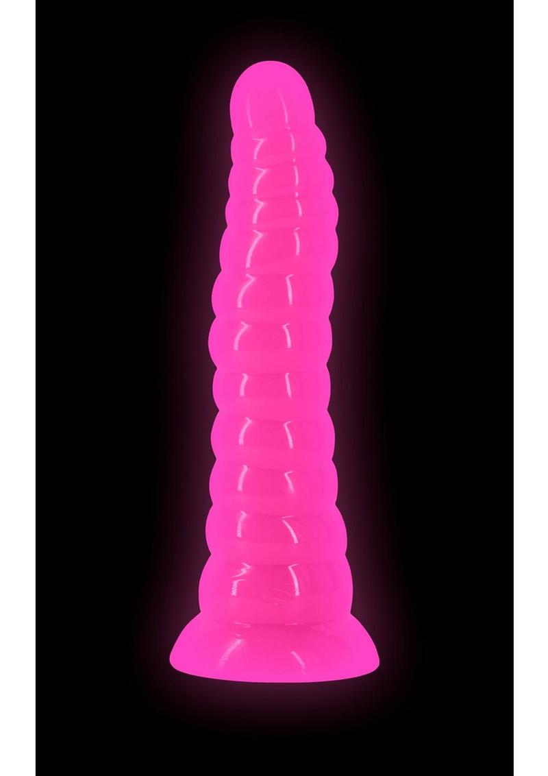Firefly Nymph Glow in The Dark Dildo Pink displayed against a dark background, glowing softly in pink.