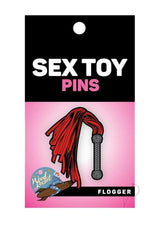 WoodRocket Flogger Enamel Pin Red Grey displayed on packaging with sex toy pins branding.