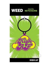 High AF Weed Enamel Keychain Green Purple Yellow against a bright green background with comic-style graphics.