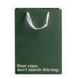 Dear Cops Don't Search This Gift Bag displayed in green Kraft paper with a white ribbon handle.