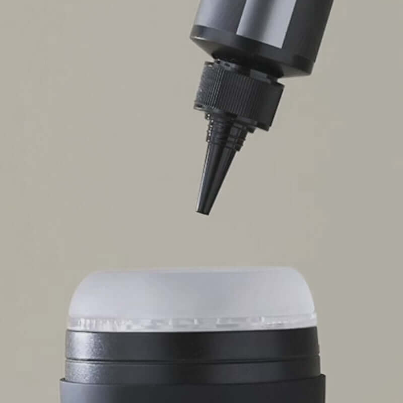 JO Stroker Lubricant 4 Oz nozzle dispensing lubricant from bottle