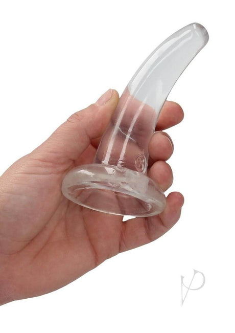 RealRock Crystal Clear 4.7 inch Suction Cup Dildo Clear held in hand with a smooth and transparent design.