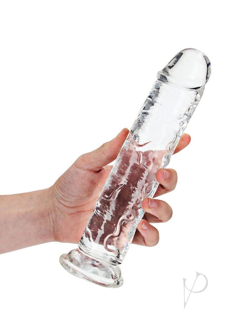 RealRock Crystal Clear Straight No Balls Dildo 9 Inch Clear held in hand, showcasing its sleek and smooth design.