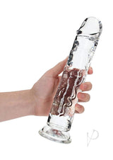 RealRock Crystal Clear Straight No Balls Dildo 10 Inch Clear held in hand, featuring transparent design and smooth shaft.