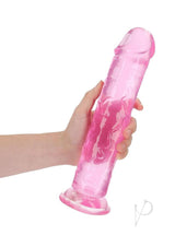 RealRock Crystal Clear Straight No Balls Dildo 11 inch Pink held in hand showcasing its transparency and suction cup base.