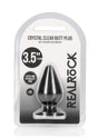 RealRock Crystal Clear 3.5 Inch Anal Plug Black packaging with suction cup, showcasing its design and features.