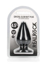 RealRock Crystal Clear 4.5 Inch Anal Plug Black packaging featuring a tapered plug with suction cup for easy use.