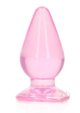 RealRock Crystal Clear Anal Plug 4.5 Inch Pink displayed on a white background, showcasing its smooth, see-through design.