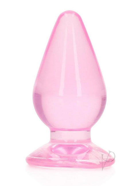 RealRock Crystal Clear Anal Plug 4.5 Inch Pink displayed on a white background, showcasing its smooth, see-through design.