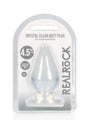 RealRock Crystal Clear Anal Plus 4.5in Clear butt plug packaging with suction cup, showcasing its transparent design.