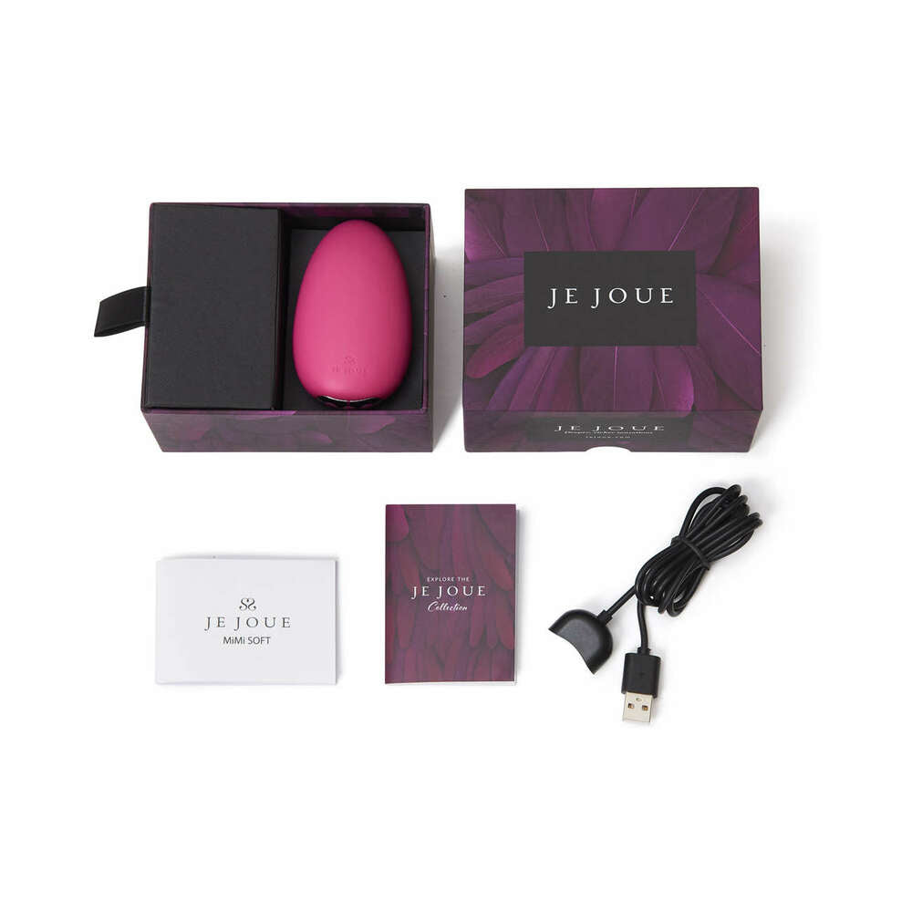 Je Joue Mimi Soft Rechargeable Silicone Clitoral Vibrator Fuchsia in elegant packaging with user manual and USB charger.