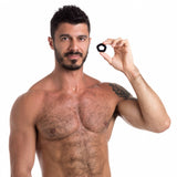 Man holding Sport Fucker Pentagon Silicone Cock Ring, highlighting its snug fit and premium silicone material.