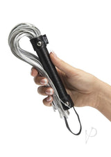 Fifty Shades of Grey Please Sir Flogger Black Silver held in hand, showcasing its faux leather design.