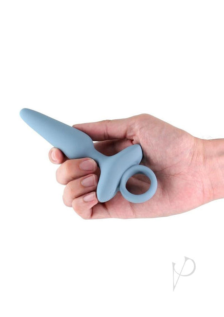 Renegade Maverick Rechargeable Silicone Anal Plug Gray being held in hand, showcasing its ergonomic design and smooth silicone finish.