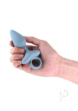 Renegade Orion Rechargeable Silicone Anal Plug Gray held in a hand, showcasing its elegant design and tapered shape.