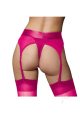 Ouch Vibrating Strap-On Thong Bullet XS SM Pink shown on model's back, featuring sleek design and vibrant color for shared enjoyment.
