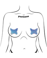 Pastease Premium Glitter Butterfly Pasties Blue on a model, showcasing shimmering butterfly coverage.