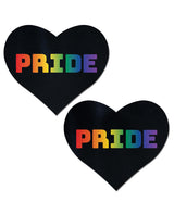 Pastease Pride Rainbow Black Adhesive Nipple Pasties in heart shape with rainbow-colored 'PRIDE' text on a black background.